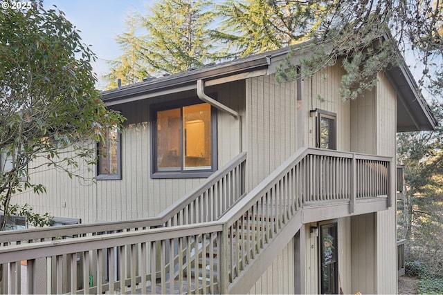 view of side of property with stairs