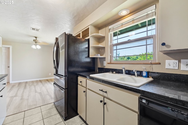 3840 Vista Dr, North Bend, OR 97459 - kitchen featuring black dishwasher, freestanding refrigerator, dark countertops, a ceiling fan, and a textured ceiling