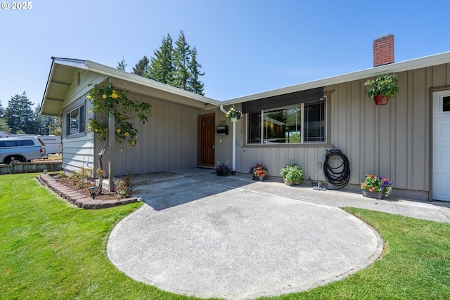 3840 Vista Dr, North Bend, OR 97459 - ranch-style house featuring a front yard, a chimney, and board and batten siding