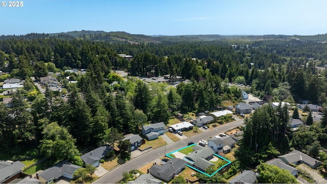 3840 Vista Dr, North Bend, OR 97459 - aerial overview of property's location with property parcel outlined and nearby suburban area