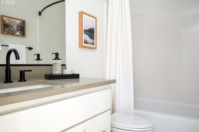 bathroom with toilet, shower / tub combo, and vanity