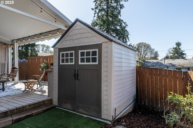 view of shed with fence