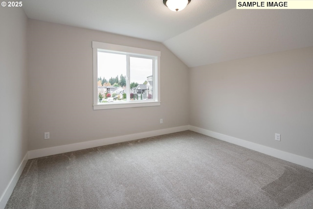 1205 S Mountain Pl, Ridgefield, WA 98642 - bonus room featuring baseboards, vaulted ceiling, and carpet flooring