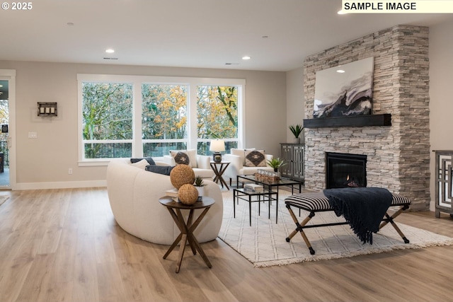 1205 S Mountain Pl, Ridgefield, WA 98642 - living room with a fireplace, wood finished floors, baseboards, and recessed lighting