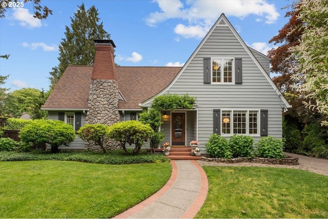7215 SE 34th Ave, Portland, OR 97202 - tudor-style house featuring a front lawn, a chimney, and roof with shingles