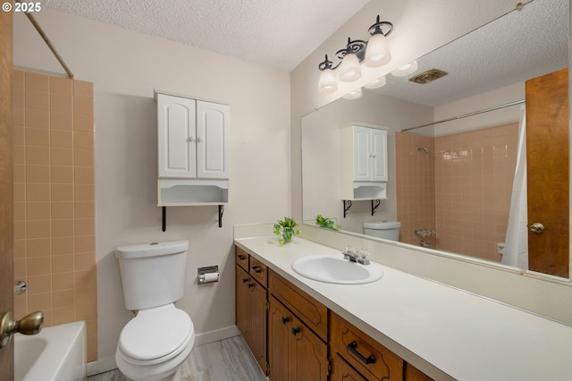 full bath featuring visible vents, toilet, shower / bath combo, a textured ceiling, and vanity