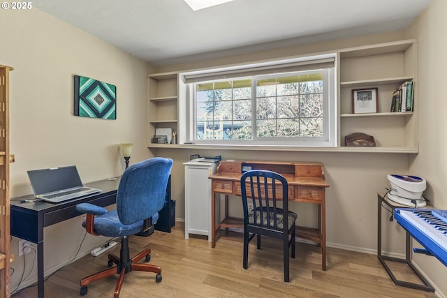 office featuring wood finished floors and baseboards