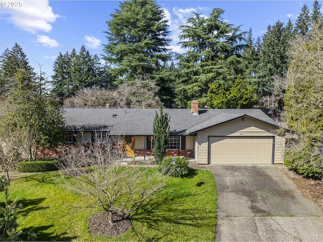 ranch-style home with a chimney, driveway, a front lawn, and a garage