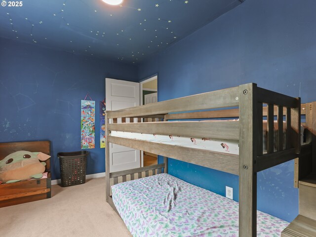 carpeted bedroom with baseboards