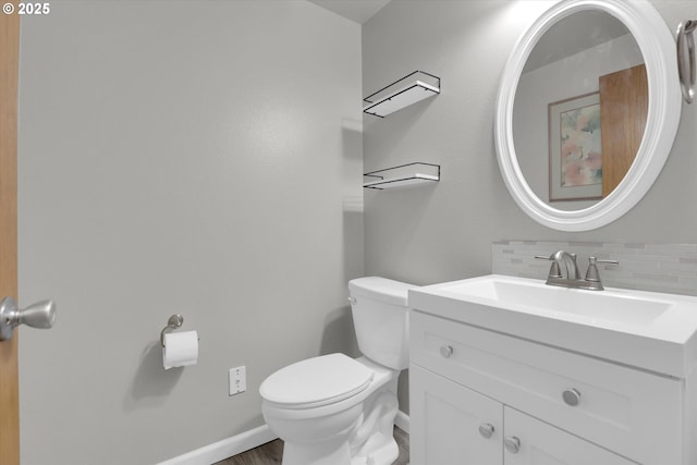 14011 NE 346th St, Battle Ground, WA 98604 - bathroom featuring backsplash, toilet, vanity, and baseboards