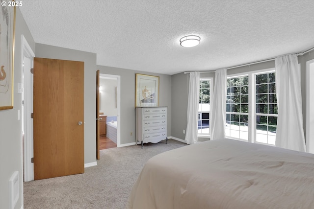 14011 NE 346th St, Battle Ground, WA 98604 - carpeted bedroom featuring a textured ceiling and ensuite bathroom