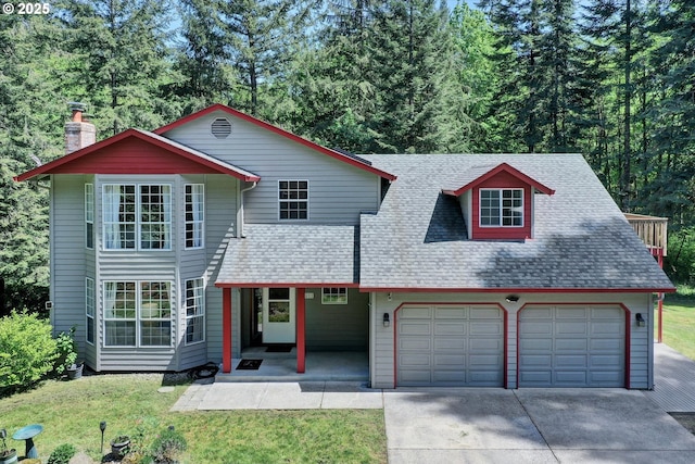 14011 NE 346th St, Battle Ground, WA 98604 - view of front of property with a garage, concrete driveway, a chimney, a front yard, and roof with shingles
