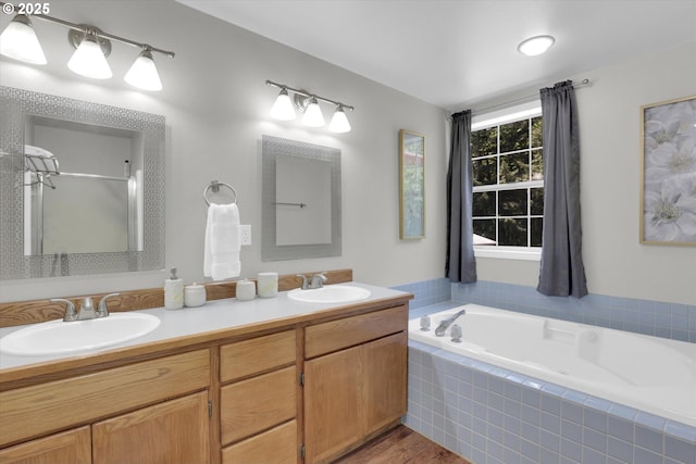 14011 NE 346th St, Battle Ground, WA 98604 - full bathroom with a garden tub, double vanity, a shower with door, and wood finished floors
