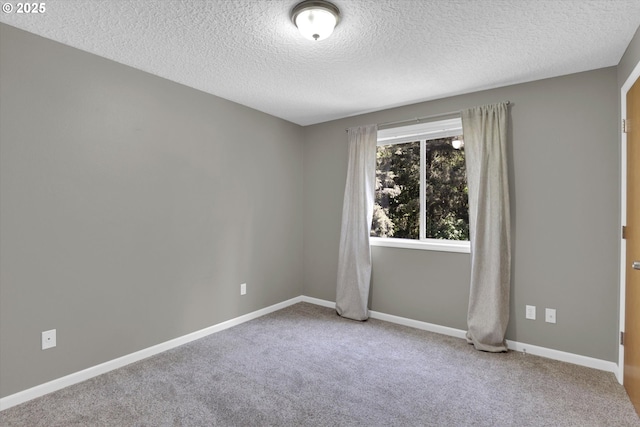 14011 NE 346th St, Battle Ground, WA 98604 - unfurnished room featuring a textured ceiling, carpet flooring, and baseboards