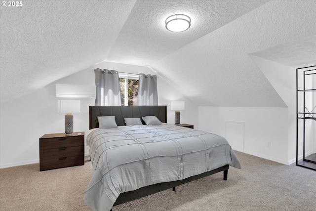 14011 NE 346th St, Battle Ground, WA 98604 - bedroom featuring a textured ceiling, carpet floors, lofted ceiling, a wall unit AC, and baseboards