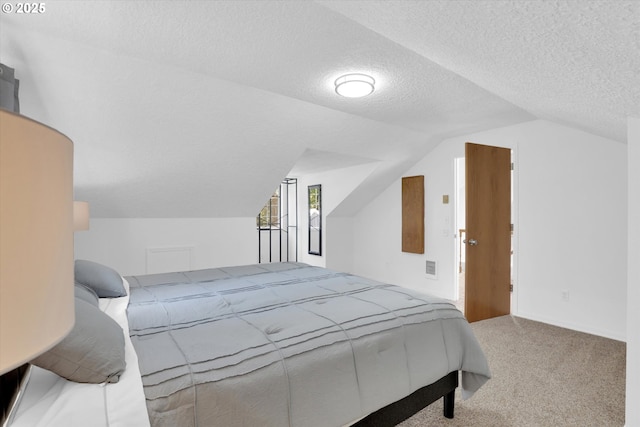 14011 NE 346th St, Battle Ground, WA 98604 - carpeted bedroom featuring vaulted ceiling and a textured ceiling