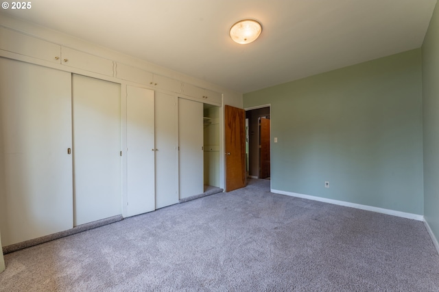 176 N Henry St, Coquille, OR 97423 - unfurnished bedroom featuring carpet floors, baseboards, and a closet