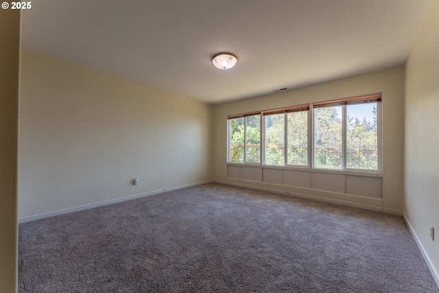 176 N Henry St, Coquille, OR 97423 - carpeted empty room featuring baseboards