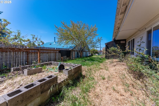 176 N Henry St, Coquille, OR 97423 - fenced backyard featuring a garden
