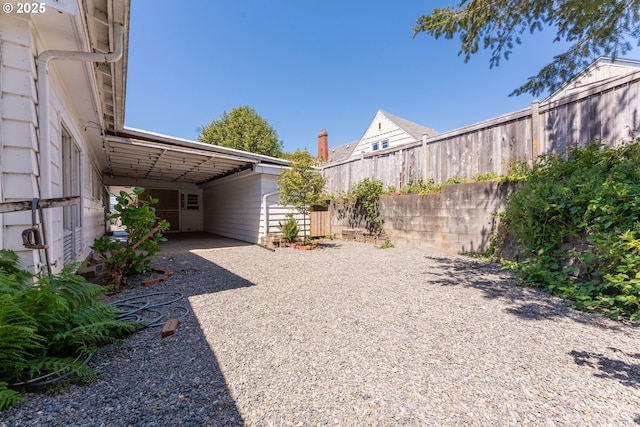 176 N Henry St, Coquille, OR 97423 - view of yard featuring a carport