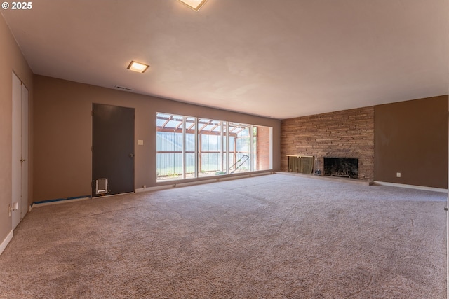 176 N Henry St, Coquille, OR 97423 - unfurnished living room with carpet flooring, a fireplace, and baseboards