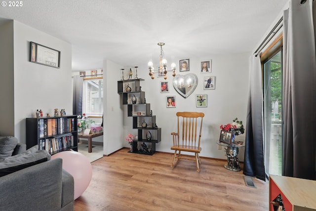 1315 SE 135th Ave, Portland, OR 97233 - sitting room featuring a chandelier and light wood-style floors
