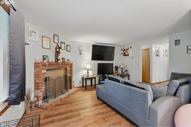 1315 SE 135th Ave, Portland, OR 97233 - living area featuring a fireplace and light wood-style flooring
