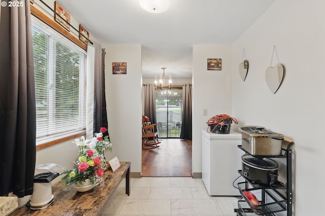 1315 SE 135th Ave, Portland, OR 97233 - hall featuring a chandelier and light marble finish flooring