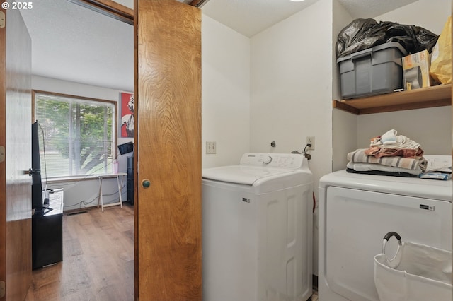 1315 SE 135th Ave, Portland, OR 97233 - clothes washing area featuring washer and dryer and wood finished floors