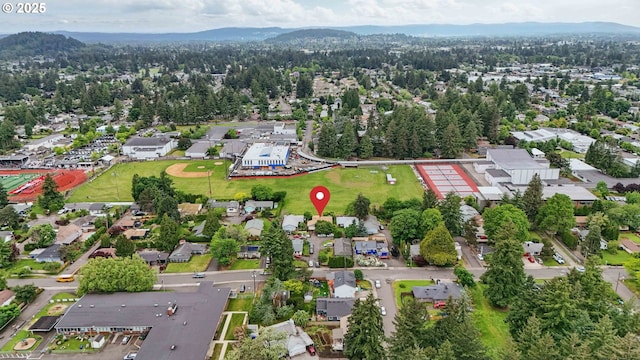 1315 SE 135th Ave, Portland, OR 97233 - aerial overview of property's location with nearby suburban area and a mountainous background