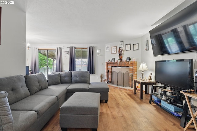 1315 SE 135th Ave, Portland, OR 97233 - living area featuring light wood finished floors and a fireplace