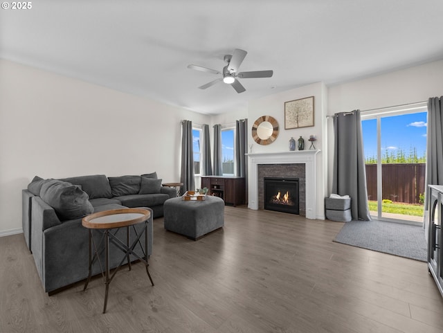 1053 Winfield St NE, Gervais, OR 97026 - living room featuring wood finished floors, ceiling fan, and a glass covered fireplace
