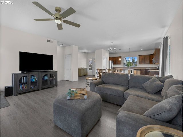 1053 Winfield St NE, Gervais, OR 97026 - living area with ceiling fan, wood finished floors, and a chandelier