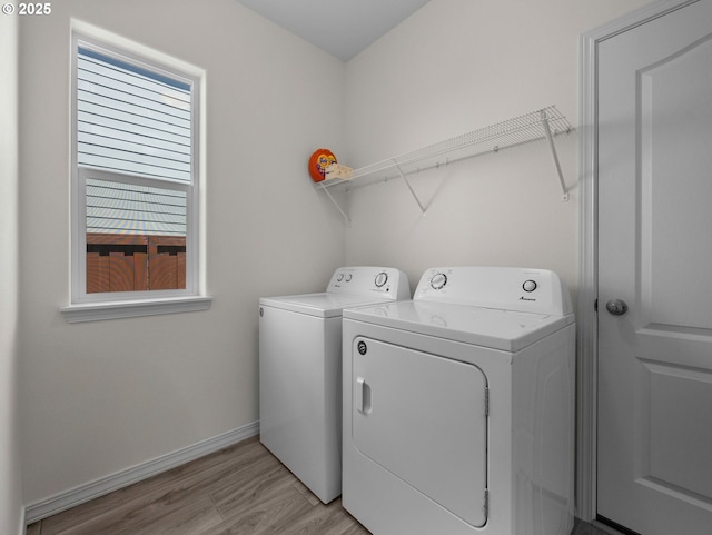 1053 Winfield St NE, Gervais, OR 97026 - laundry room with independent washer and dryer, healthy amount of natural light, and light wood-type flooring