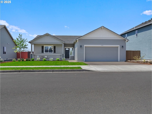 1053 Winfield St NE, Gervais, OR 97026 - ranch-style house featuring an attached garage, covered porch, and driveway