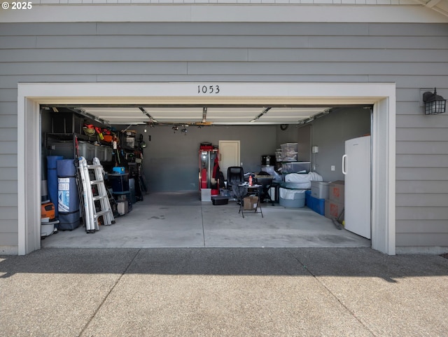 1053 Winfield St NE, Gervais, OR 97026 - garage featuring freestanding refrigerator and driveway