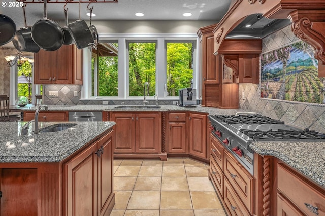 kitchen featuring a sink, appliances with stainless steel finishes, plenty of natural light, and recessed lighting