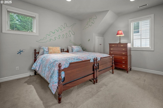 bedroom with light carpet, baseboards, and vaulted ceiling