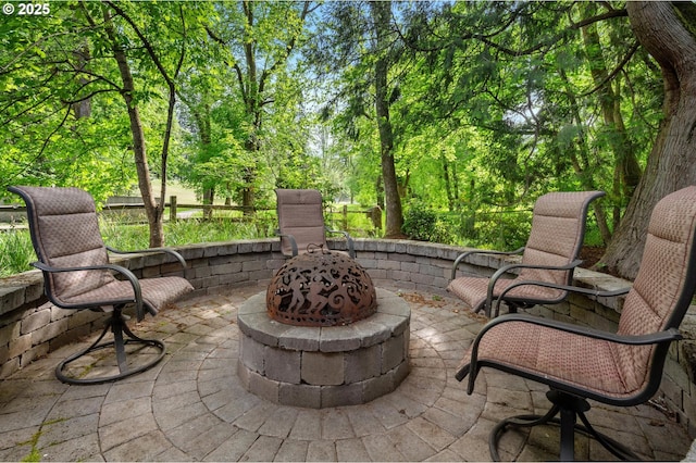 view of patio / terrace featuring a fire pit