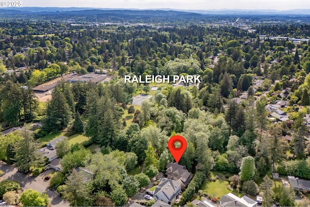 aerial view of property's location with a forest