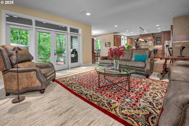 living room with recessed lighting, baseboards, and french doors