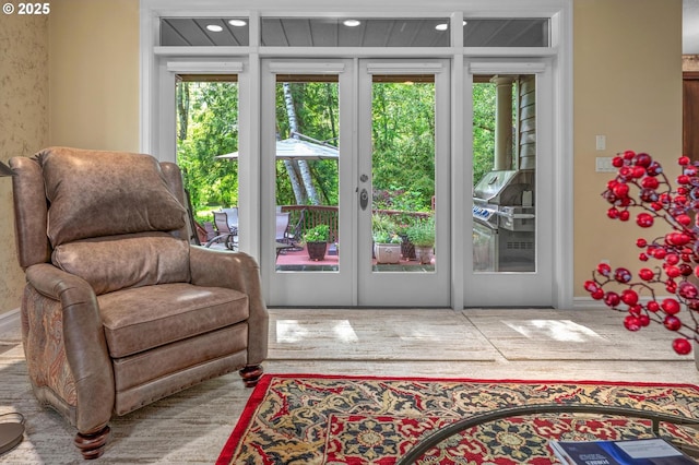 sitting room with french doors and recessed lighting