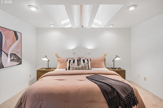 carpeted bedroom featuring recessed lighting and a skylight