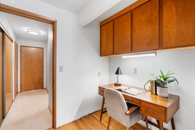 office space with light wood-style floors