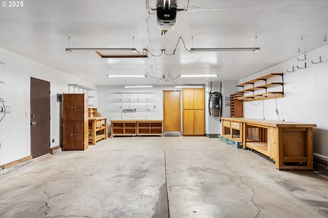 garage featuring a workshop area and a garage door opener