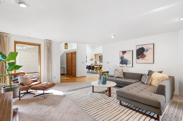 living area featuring light colored carpet