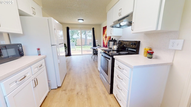 kitchen featuring black microwave, light wood-type flooring, stainless steel electric range, white cabinets, and under cabinet range hood