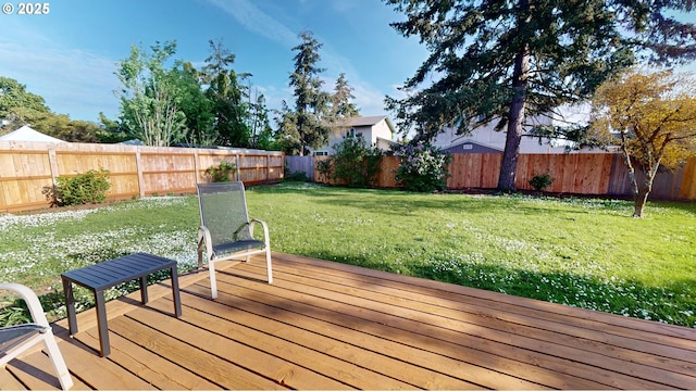 deck featuring a fenced backyard and a yard