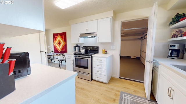 kitchen with stainless steel electric stove, light countertops, under cabinet range hood, and white cabinetry