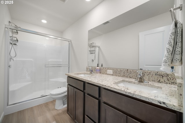 3563 SE Richey Rd, Gresham, OR 97080 - bathroom with wood finished floors, a shower stall, toilet, double vanity, and recessed lighting